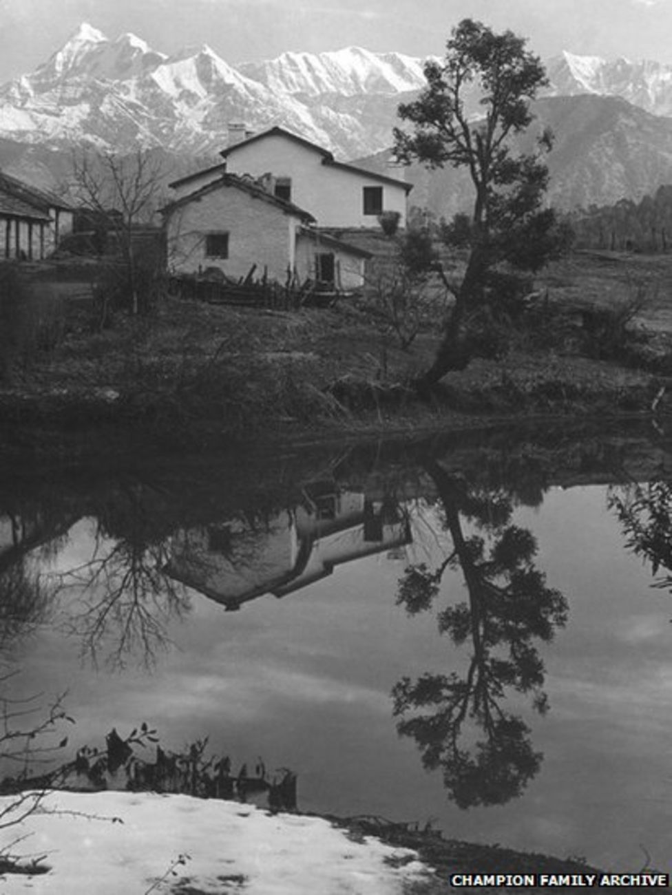 The Forest Rest House at Gwaldam, with the holy mountain Trisul in the background. This is a similar house to what the photographer, his wife and young son stayed in while he was working.
